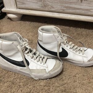 Nike White High-Top Sneakers with Black Swoosh Accents